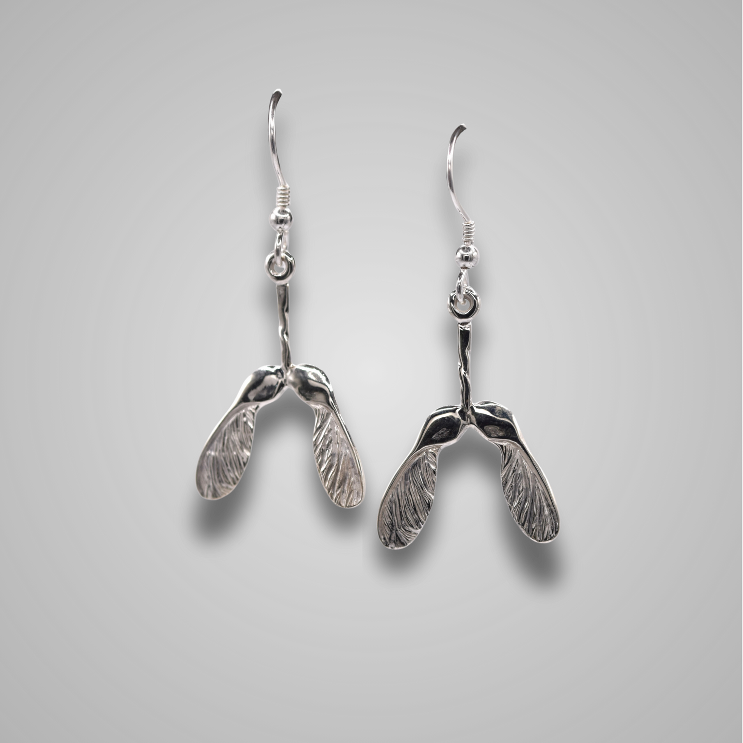 Sycamore seeds made from silver. On silver hooks, a statement piece of jewellery which is sparkly and elegant.