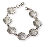 Silver daisy chain bracelet on a white background