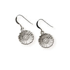 Silver daisy-shaped earrings on a white background