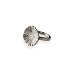 Silver daisy ring on a white background