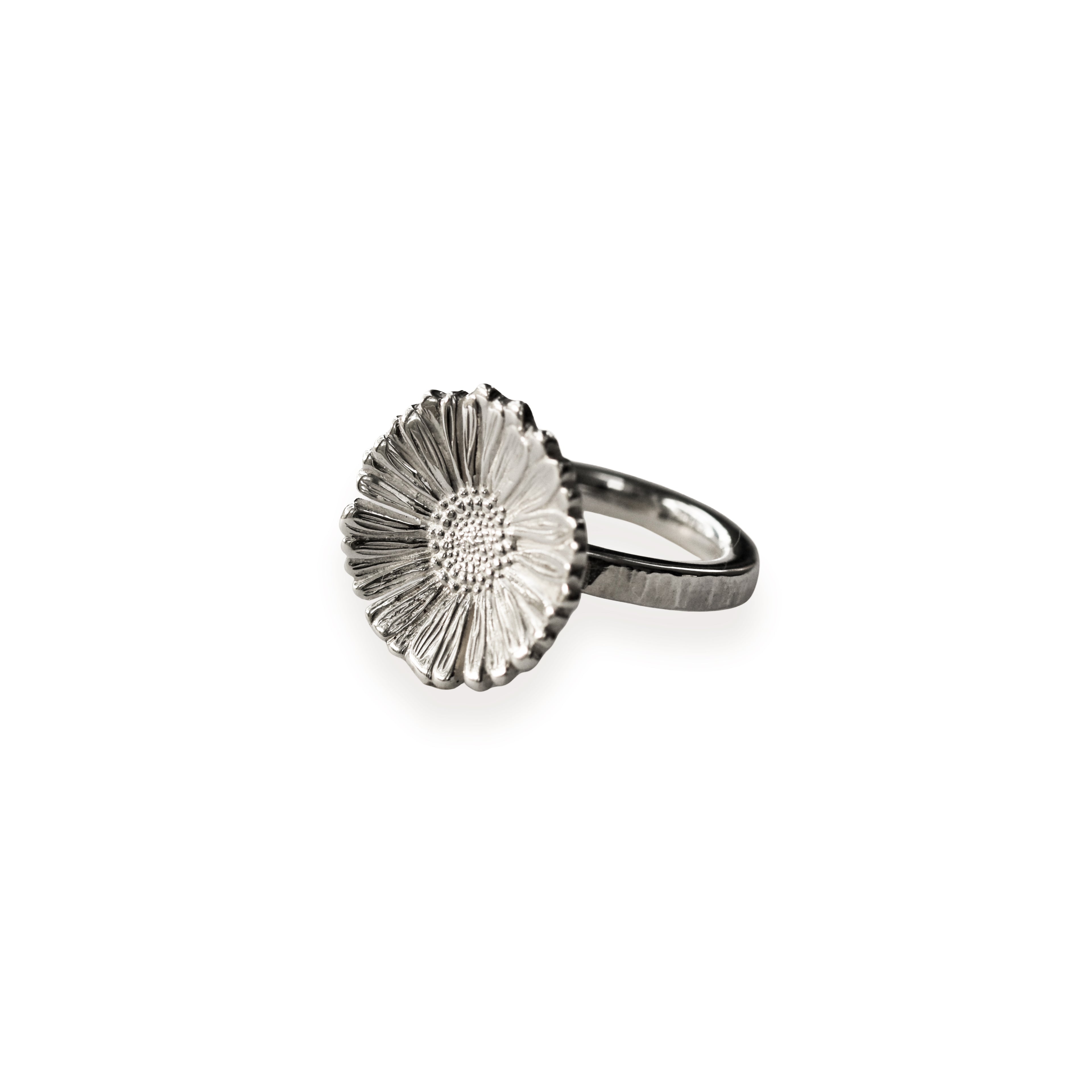 Silver daisy ring on a white background