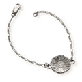 Silver bracelet with a single daisy on a white background