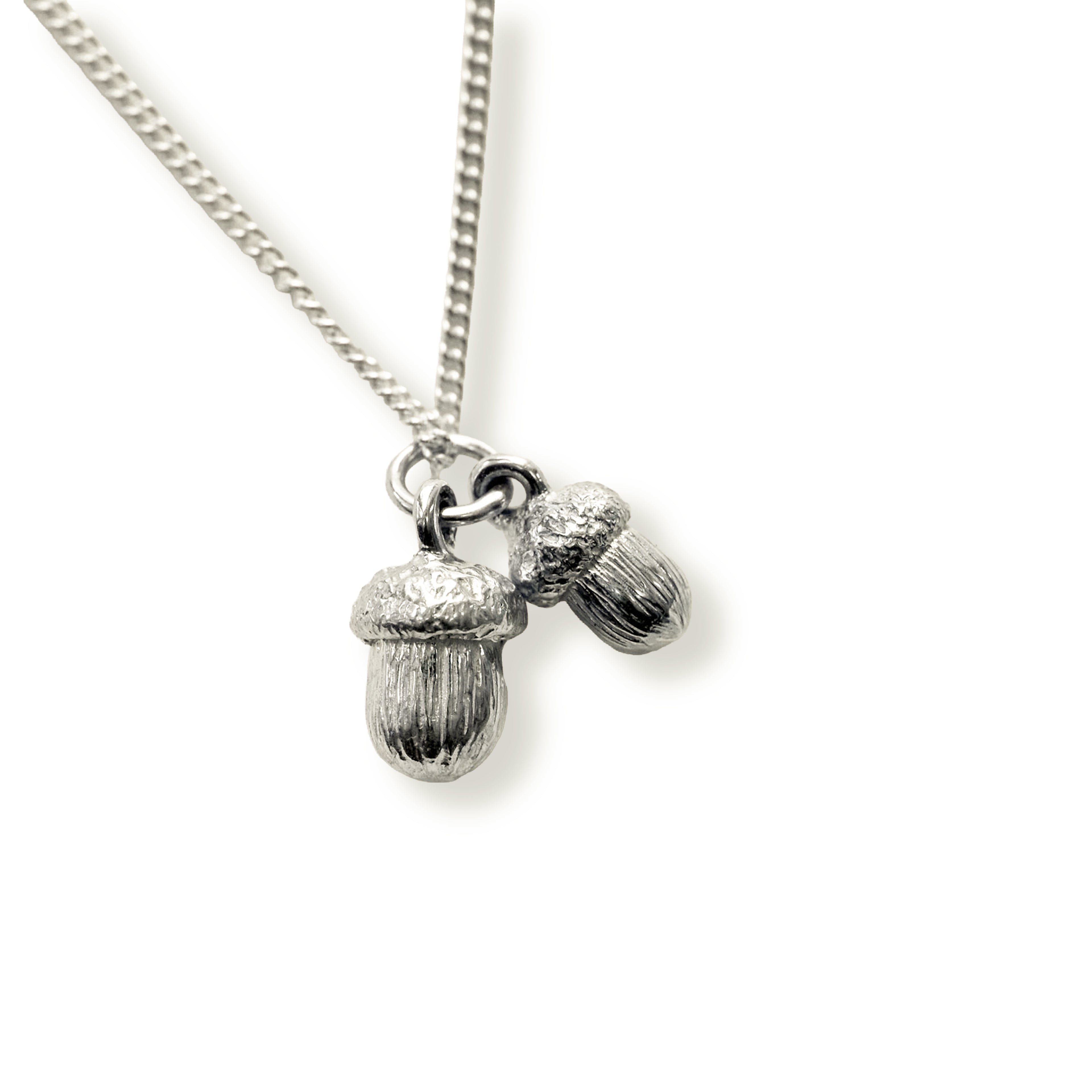Silver 2 acorn pendant necklace on a white background