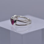 A spilt shank ring with 3 Pink tourmaline stones