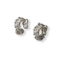 Pair of silver hoop earrings covered in flowers all the way around on a white background