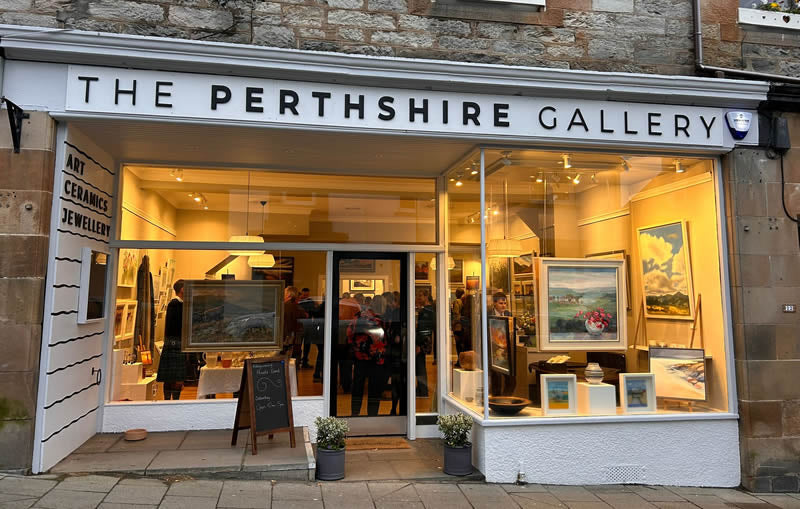 The Perthshire Gallery with artworks displayed inside, set against a stone building.
