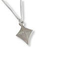 Silver geometric pendant on kite shape necklace on a white background