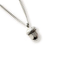 Silver acorn pendant necklace on a white background