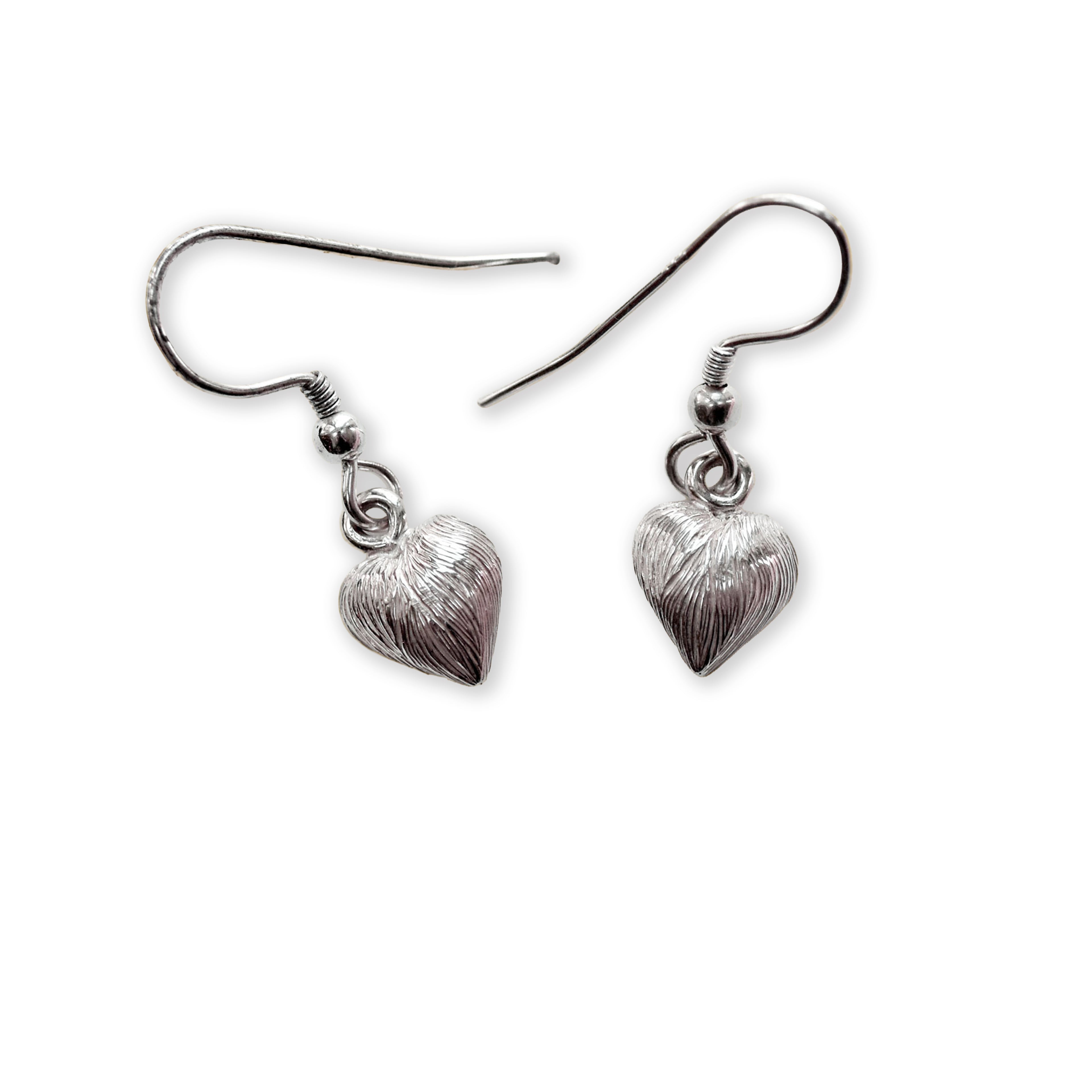 Pair of silver heart-shaped earrings on a white background