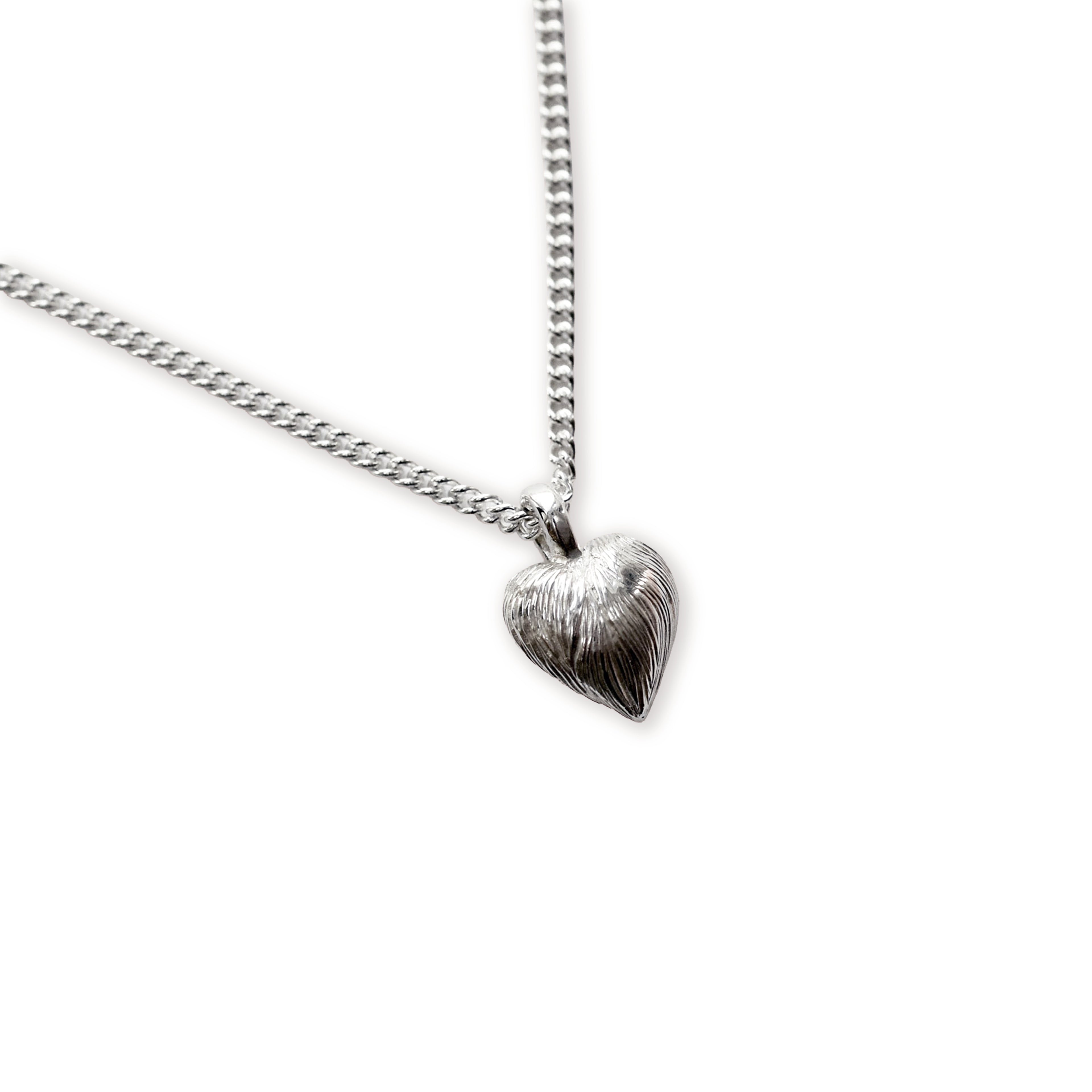 Silver heart-shaped pendant on a chain against a white background
