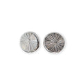 Pair of silver circular earrings with radiating texture on a white background