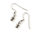 Pair of silver acorn earrings on a white background