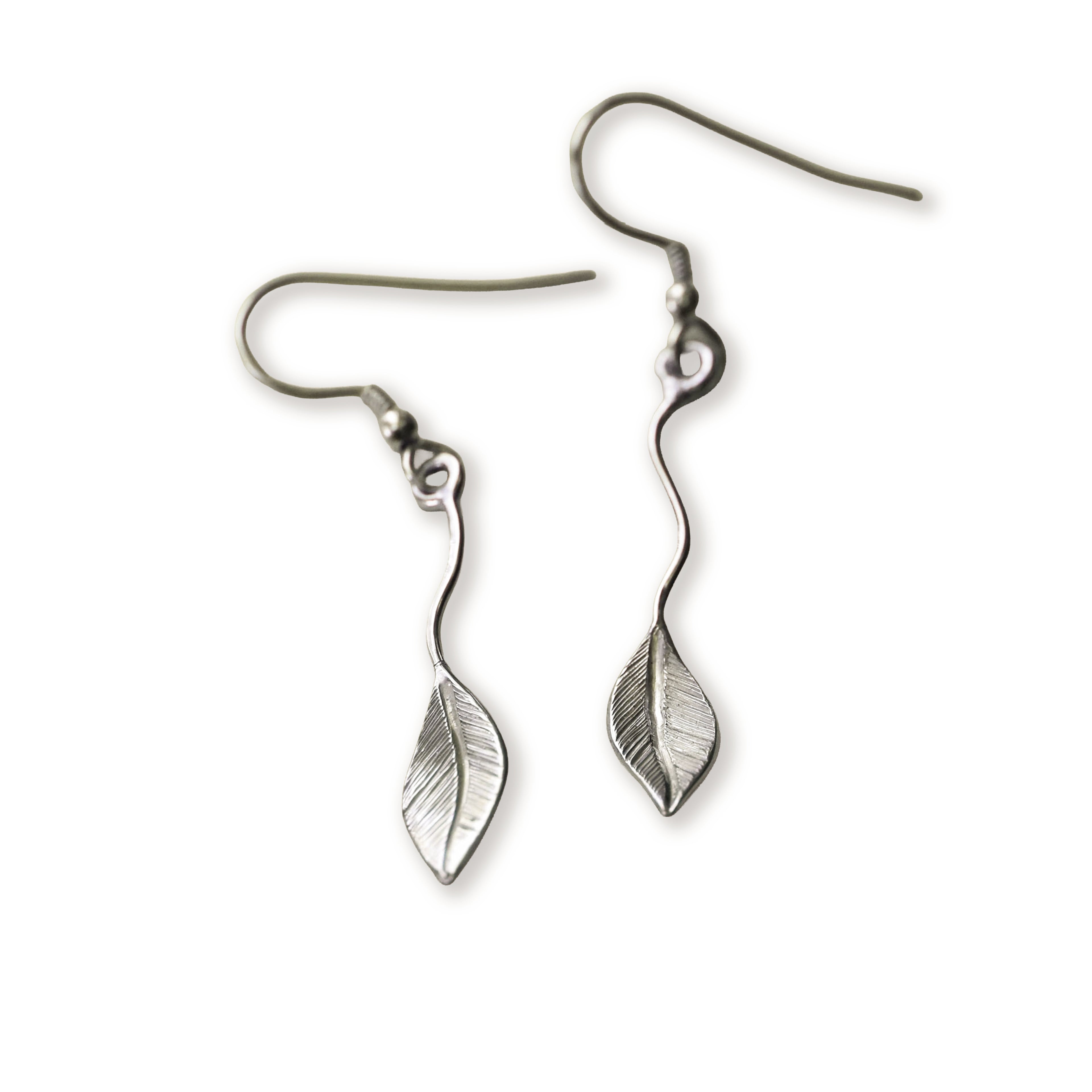 Silver leaf-shaped earrings on flowing wire on a white background
