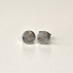 Pair of silver spiral earrings on a white background