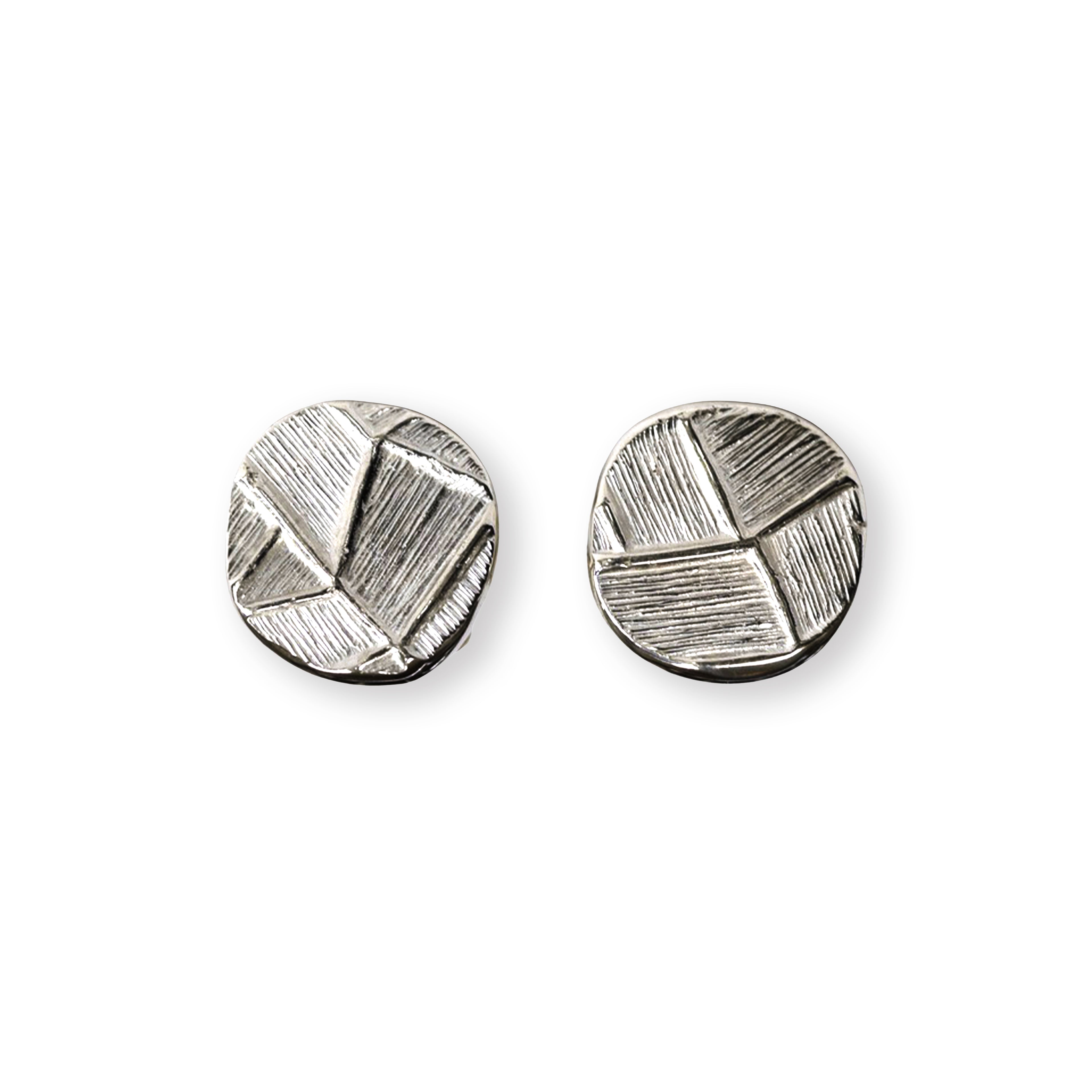 silver geometric earrings on a white background