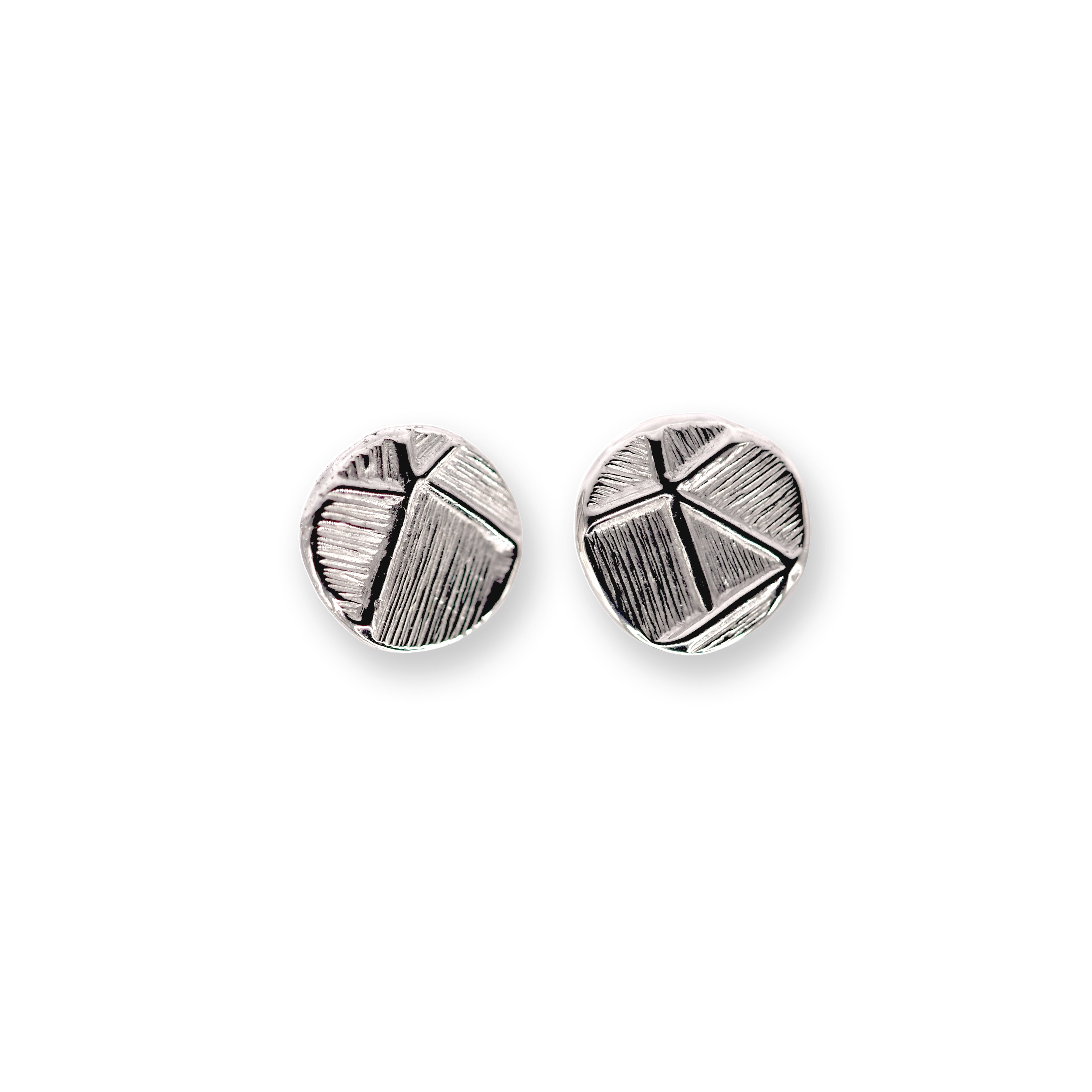 Pair of silver geometric stud earrings on a white background