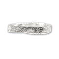 silver ring with radiating pattern on a wite background